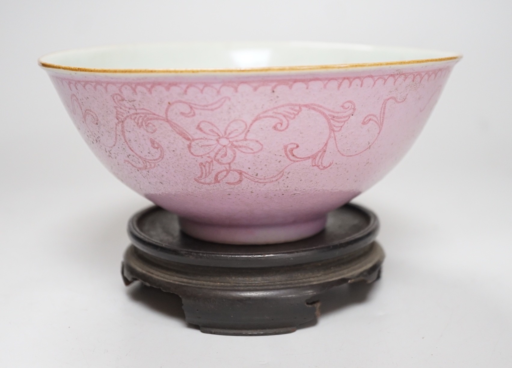 An early 19th century? Chinese powder pink ground export porcelain bowl, 17cm (a.f.), on associated pierced carved hardwood stand